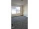 Bright bedroom featuring neutral carpeting and two large windows at 320 Eastfield Dr, Rocky Mount, NC 27801