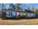 Single-story manufactured home with a brown exterior and landscaping at 320 Eastfield Dr, Rocky Mount, NC 27801