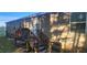 Home's back exterior, showcasing a wooden deck and stairs at 320 Eastfield Dr, Rocky Mount, NC 27801