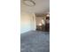 Living room with carpet flooring and view into kitchen at 320 Eastfield Dr, Rocky Mount, NC 27801