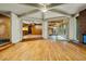 Open-concept living room featuring hardwood floors, fireplace, and natural light at 3237 Birnamwood Rd, Raleigh, NC 27607