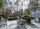 Peaceful patio with seating area, surrounded by lush landscaping at 3500 Chaucer Pl, Raleigh, NC 27609