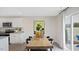 Bright dining area with wood table and access to backyard at 3600 Sorda Ct, Raleigh, NC 27610