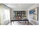 Home office with built-in shelving and large desk at 3600 Sorda Ct, Raleigh, NC 27610