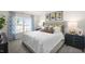 Cozy bedroom with a king-size bed and ample natural light at 3605 Sorda Ct, Raleigh, NC 27610