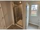 Bathroom with shower and built-in seat at 3732 Massey Pond Trl, Raleigh, NC 27616