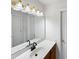 Clean bathroom with double sink vanity and large mirror at 408 Froyle Ct, Rolesville, NC 27571
