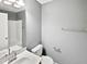 Clean bathroom with single sink vanity, toilet and shower/tub combo at 408 Froyle Ct, Rolesville, NC 27571