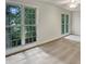 Bright bedroom with large windows offering natural light and tree views at 408 Froyle Ct, Rolesville, NC 27571