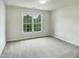 Bedroom featuring a large window providing ample natural light and outdoor views at 408 Froyle Ct, Rolesville, NC 27571