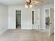 Spacious bedroom with ceiling fan, a large closet and access to other rooms at 408 Froyle Ct, Rolesville, NC 27571