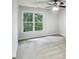 Bedroom with a ceiling fan and a bright window overlooking the backyard at 408 Froyle Ct, Rolesville, NC 27571