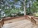 Wood deck overlooks the spacious, tree-filled backyard, providing an ideal spot for outdoor relaxation and entertainment at 408 Froyle Ct, Rolesville, NC 27571