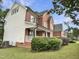 A two-story home has a brick section and a white, vinyl siding section at 408 Froyle Ct, Rolesville, NC 27571