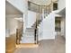 Welcoming foyer featuring a staircase with decorative iron railings and wood accents at 408 Froyle Ct, Rolesville, NC 27571