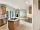 Open-concept kitchen includes a kitchen island and stainless steel appliances at 408 Froyle Ct, Rolesville, NC 27571