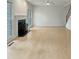 Spacious living room featuring a fireplace, hardwood floors, and large windows at 408 Froyle Ct, Rolesville, NC 27571