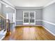 Bright living room with hardwood floors and large windows at 408 Froyle Ct, Rolesville, NC 27571