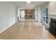 This is a spacious living room with a view of the kitchen and a fireplace at 408 Froyle Ct, Rolesville, NC 27571