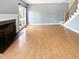 Spacious living room featuring hardwood floors, fireplace and large windows at 408 Froyle Ct, Rolesville, NC 27571