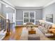 Spacious living room featuring hardwood floors and a neutral color palette at 408 Froyle Ct, Rolesville, NC 27571