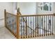Staircase with wood and iron banister leading to the home's entryway and second story at 408 Froyle Ct, Rolesville, NC 27571