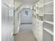 Bright walk-in closet with built-in shelving and ample storage space at 408 Froyle Ct, Rolesville, NC 27571