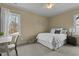 Well-lit bedroom with a queen-size bed and workspace at 455 Shadowdale Ln, Rolesville, NC 27571