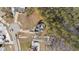 An aerial shot of a house amongst other homes, with a large wooded area behind at 46 Trusting Ln, Middlesex, NC 27557