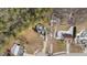 Aerial perspective showcasing a house on a wooded lot at 46 Trusting Ln, Middlesex, NC 27557