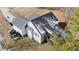 Aerial view of a house with a gray exterior and a dark gray roof at 46 Trusting Ln, Middlesex, NC 27557