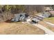 Aerial view showing a house nestled in a wooded neighborhood at 46 Trusting Ln, Middlesex, NC 27557