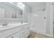 A clean bathroom featuring a double vanity, walk in shower, and modern fixtures at 46 Trusting Ln, Middlesex, NC 27557