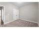 A bedroom with neutral carpet and a closet with double doors at 46 Trusting Ln, Middlesex, NC 27557