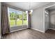 Bright dining room featuring hardwood floors, a chandelier, and natural light at 46 Trusting Ln, Middlesex, NC 27557