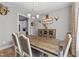Dining room with rustic decor, chandelier, and view into the kitchen at 46 Trusting Ln, Middlesex, NC 27557