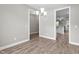 Open dining room with hardwood floors, chandelier, and views into the kitchen at 46 Trusting Ln, Middlesex, NC 27557