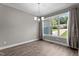 Dining room with a chandelier, large window, and neutral-colored walls at 46 Trusting Ln, Middlesex, NC 27557