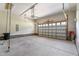 Spacious garage with concrete floors and an automated door offers ample parking and storage space at 46 Trusting Ln, Middlesex, NC 27557