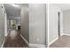 Hallway view with neutral paint, leading to the living room with a fireplace at 46 Trusting Ln, Middlesex, NC 27557
