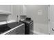 Laundry room with washer, dryer, and overhead cabinets at 46 Trusting Ln, Middlesex, NC 27557