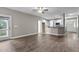 Open concept living room with hardwood floors and a view of the outdoor deck at 46 Trusting Ln, Middlesex, NC 27557