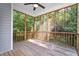 Screened porch with wood flooring and ceiling fan offers a relaxing outdoor living space at 46 Trusting Ln, Middlesex, NC 27557