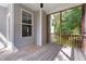 View of screened porch and wood flooring offers a relaxing view of a wooded lot at 46 Trusting Ln, Middlesex, NC 27557