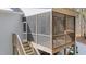 Wooden screened porch with stairs leading down to the yard at 46 Trusting Ln, Middlesex, NC 27557