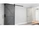 Grey barn door and neutral walls in bedroom at 470 Thomas Rd, Henderson, NC 27537