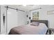 Serene bedroom featuring a double bed and sliding barn door at 470 Thomas Rd, Henderson, NC 27537