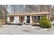 White house with brown roof and landscaping at 470 Thomas Rd, Henderson, NC 27537