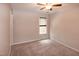 Bedroom features neutral carpet, neutral walls, ceiling fan, and one window with shade at 496 Omaha Dr, Broadway, NC 27505