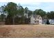 Two story house with a large yard and surrounding trees at 496 Omaha Dr, Broadway, NC 27505